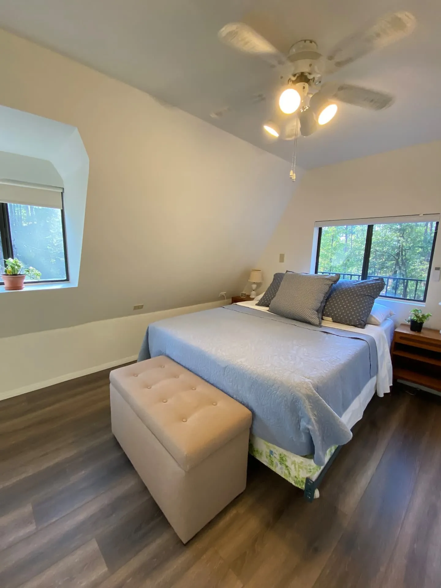 Bedroom with forest views through the trees