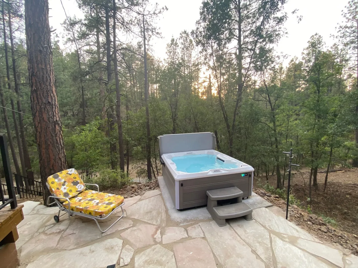 The private hot tub on the deck, wrapped in Groom Creek pines